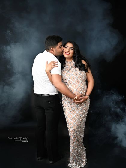 A joyful and affectionate moment. The smoky effect adds a touch of drama and magic to this glamorous couple's portrait.
