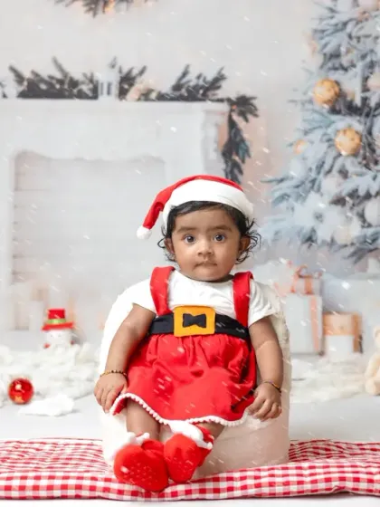 A little one's first Christmas. My festive mini sessions include adorable Santa outfits and a winter wonderland setup to capture this special milestone.