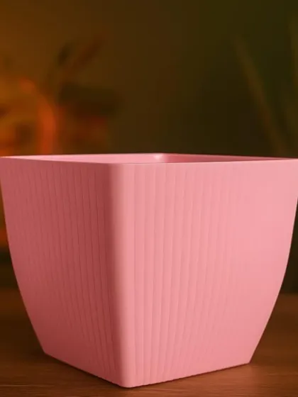 A single pink square pot, showing the simple, modern design. Choosing the right pot is an important part of finishing the look of your artificial plant arrangement.
