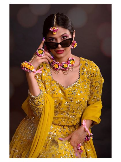 A fun and modern take on the traditional look, with the model adding sunglasses. This shows how we can play with style to reflect your personality.