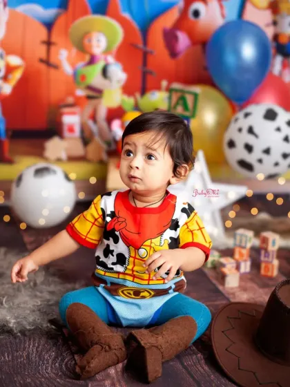 Looking up with so much wonder. This candid shot captures the magic of being surrounded by his favourite toys.