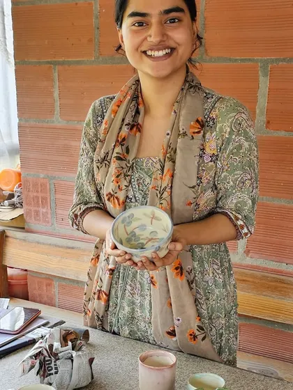 This is what it's all about for me. Seeing a student so happy and proud of the beautiful bowl she created and painted herself makes my heart full. It’s a joy to be a part of their creative journey.