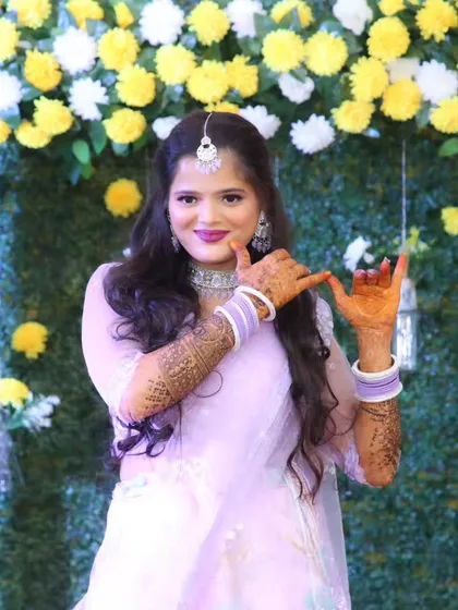 A fun and playful shot of the bride at her sangeet, ready to dance the night away.