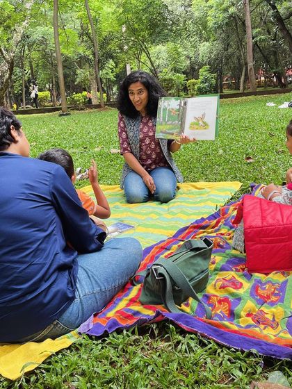 Reading 'The Gruffalo' to an eager audience. Using different voices and expressive gestures, I bring the classic characters of the deep, dark wood to life.