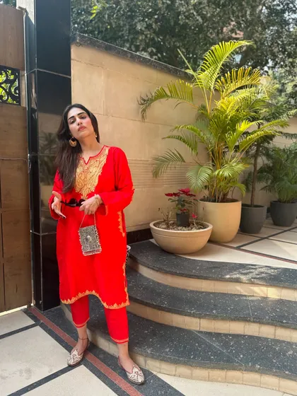This red Kashmiri embroidered suit was another one of my designs. I love incorporating traditional crafts into modern silhouettes.