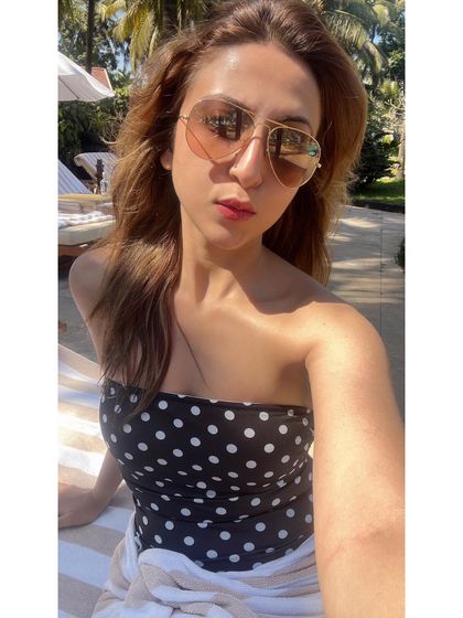 Soaking up the sun in Goa. A simple polka dot bandeau top is perfect for a relaxed day by the pool.