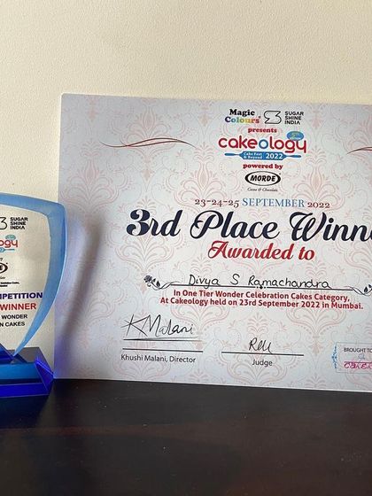 My third-place trophy and certificate from Cakeology 2022, a reminder of a wonderful achievement.