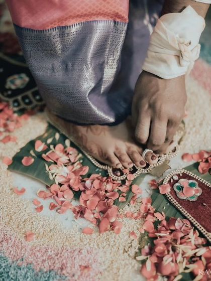 A close-up of a bride's feet during the toe ring ceremony, a significant ritual in many South Indian weddings. I focus on these details to tell a complete wedding story.
