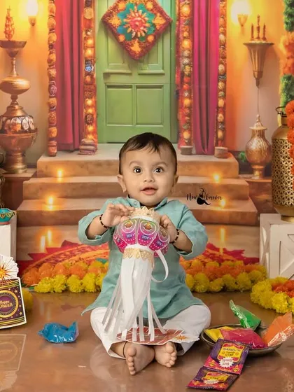 Exploring a paper lantern (kandil), this baby is full of curiosity and joy. Our Diwali sessions are designed to be interactive and fun for the little ones.