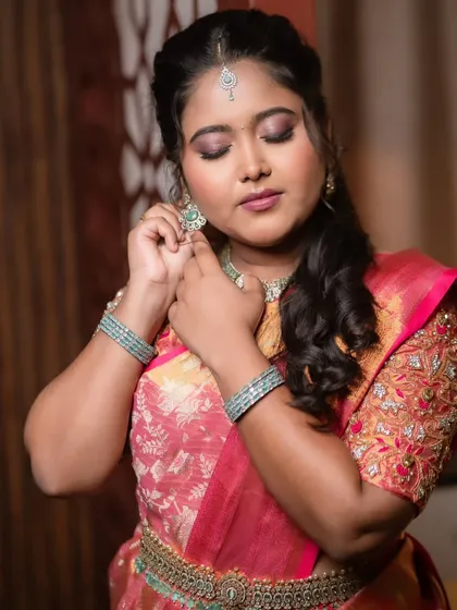 A beautiful portrait of a bride at her reception, looking down gracefully.