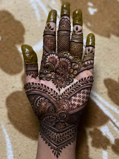Being creative is a way of life for me. This design showcases that passion, with its intricate patterns and a blend of different mehendi styles on the palm and fingers.