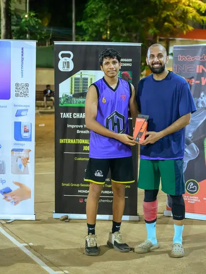 Jaden receives the Best Defensive Player award for the men's category at Hooplah '24 for his lockdown defense.