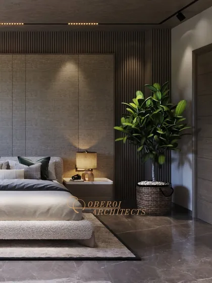 The inclusion of a large houseplant adds a touch of nature and freshness to the modern, textured space.