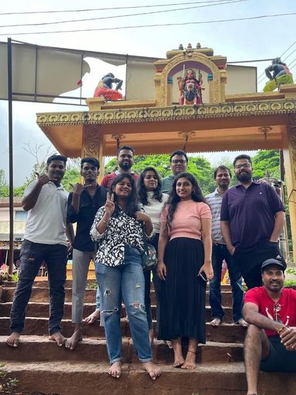 Our group at the entrance to a temple in Chikmagalur, taking a moment to appreciate the local culture.