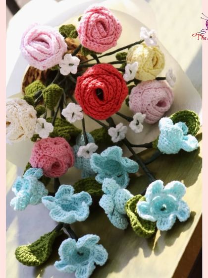An overhead view of an un-wrapped bouquet, showing the variety of flowers and foliage that go into each arrangement.