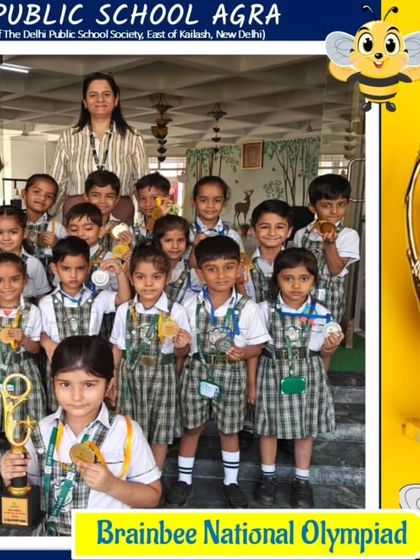 Winners from the Handwriting competition (Group A) at Delhi Public School, Agra, proudly display their medals from the 2024 Olympiad.