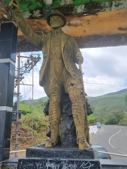A statue commemorating the pioneers who built the roads through the hills of Valparai. Our trips here are a journey through history and stunning natural beauty.