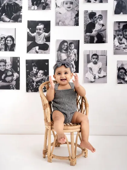 Celebrating a first birthday with the "Memory Lane" theme, using your family's own photos to create a deeply personal and meaningful backdrop.