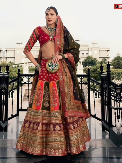 Radiate elegance in this red and multi-colored lehenga. The unique color combination makes it a memorable choice for a wedding function.