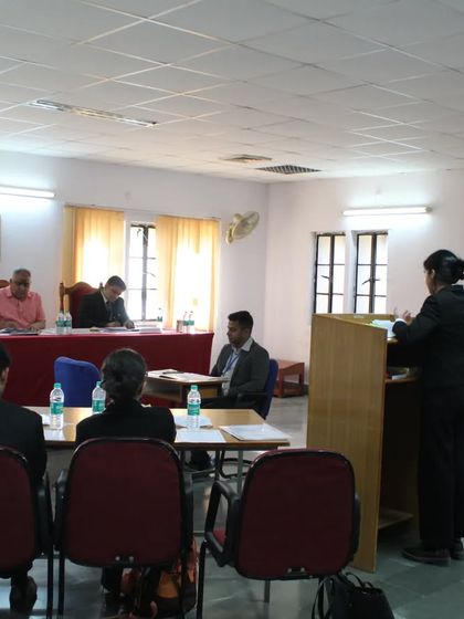 Observing the arguments presented by a student team during the moot court competition at NLU Jodhpur. The quality of advocacy was impressive.
