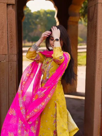 A candid-style shot, capturing the model adjusting her hair. These unposed moments often result in the most natural and beautiful portraits.