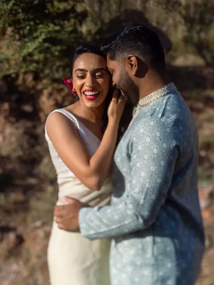 A beautiful, candid laugh captured in the warm sunlight. This photo radiates happiness and love, taken just hours before their wedding ceremony.