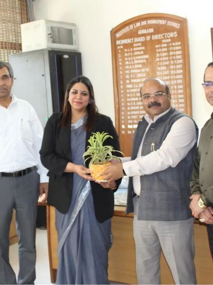 Receiving a token of appreciation from the faculty at MDU Law College. Participating in these events allows me to give back to the legal community and interact with bright young minds.