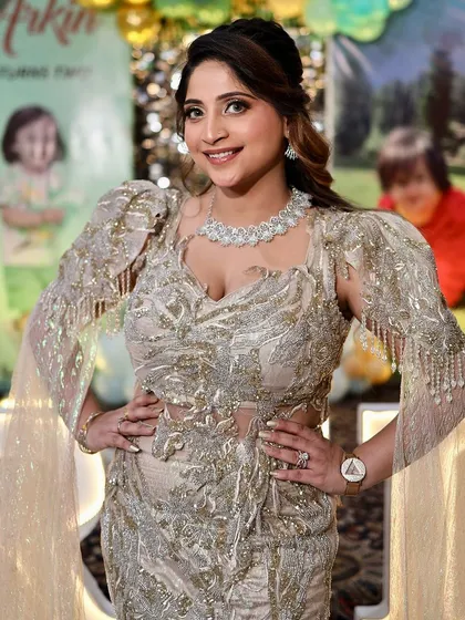 Dripping in glam and confidence. A client looking absolutely stunning in one of our heavily embellished gowns at a birthday party.