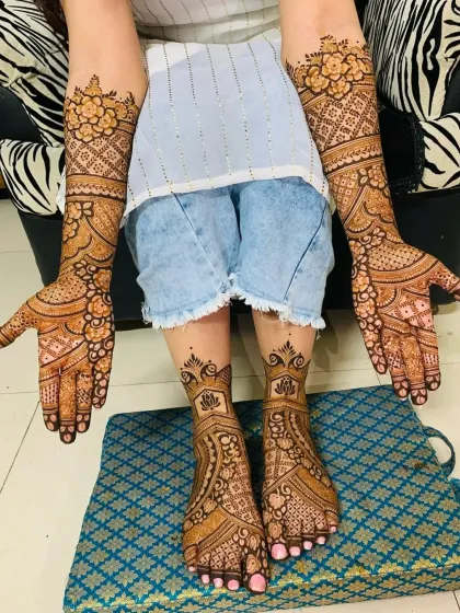This shows a complete bridal mehndi set, with coordinated designs for both hands and feet. I ensure the patterns flow beautifully to create a cohesive and stunning look for your big day.