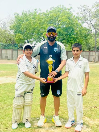 With the two top performers of the tournament, holding the trophy. Their dedication is inspiring.
