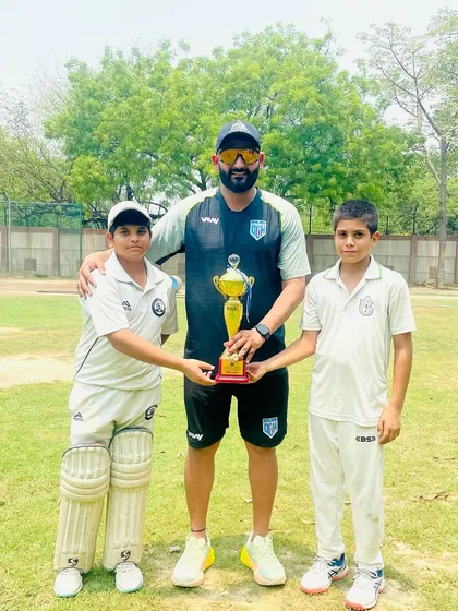 With the two top performers of the tournament, holding the trophy. Their dedication is inspiring.