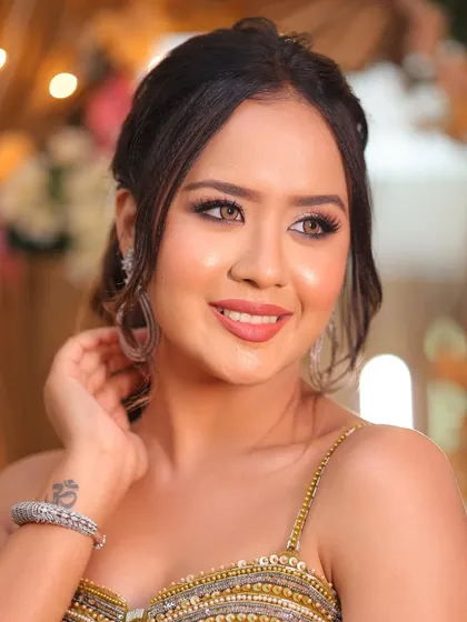 The perfect smile to complete the look. This bride is radiating happiness and confidence, ready to celebrate her reception in style.