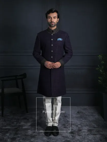 Elegance is eternal. This handloom silk achkan in dark wine celebrates the artistry of Indian hands, with zari embroidery like antique gold treasures and buttons that echo regality.