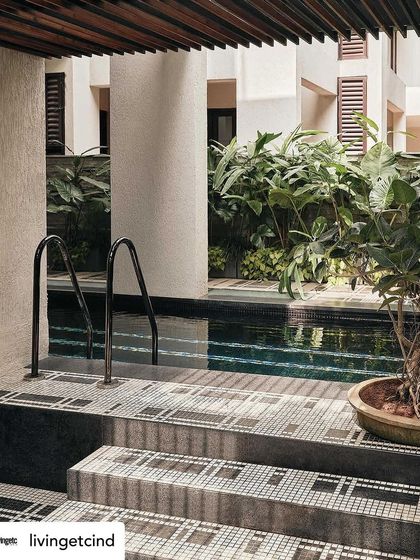 The tranquil pool and mosaic-tiled deck, a highlight of our project featured in Livingetc.