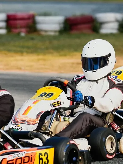 A line of karts on the grid, ready for the start of a Rotax race.