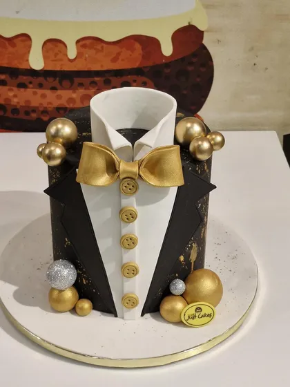 Sharp, stylish, and sophisticated. This 3kg tuxedo cake is perfect for celebrating the gentleman in your life. It features a black and white fondant design with a golden bow tie and buttons, accented with gold and silver spheres for a touch of class.