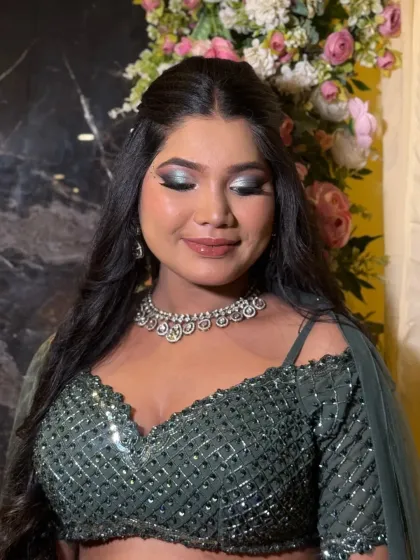 This is what full glam is all about. I created a dramatic silver and black smokey eye, paired with a glossy nude lip to balance the look, perfect for a sangeet or cocktail night.