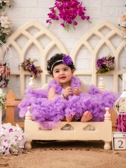 A beautiful portrait in a lavender-themed setup. The different shades of purple and pink create a rich and visually stunning backdrop.