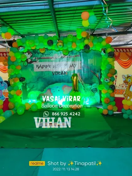 We brought the jungle to life for Vihan's first birthday. This jungle safari theme uses a lush green backdrop, animal cutouts, and a full balloon arch to create a wild and fun adventure for all the guests.
