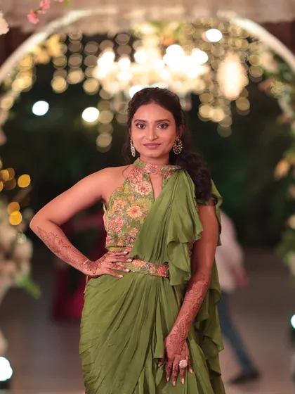 For this wedding guest look, I focused on creating a minimal, dewy base that looks fresh and natural. The makeup is paired with a modern, textured ponytail to complement her stylish indo western ruffled saree.