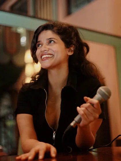 A happy host means a happy crowd. This is me in my element, getting ready to kick off another unforgettable karaoke night at Daysie on MG Road.