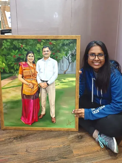 Me with the finished 24x30 inch couple's portrait. I'm sitting on the floor to show the large scale of the canvas.
