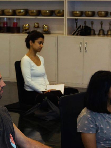 Listening intently during a philosophy lecture in Mysore. The journey of a yoga teacher is one of a perennial student.