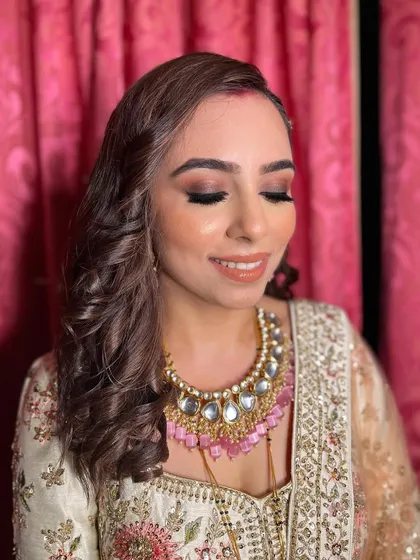 A close-up of Akshita's makeup, with her eyes closed to show the blended smokey eyeshadow.