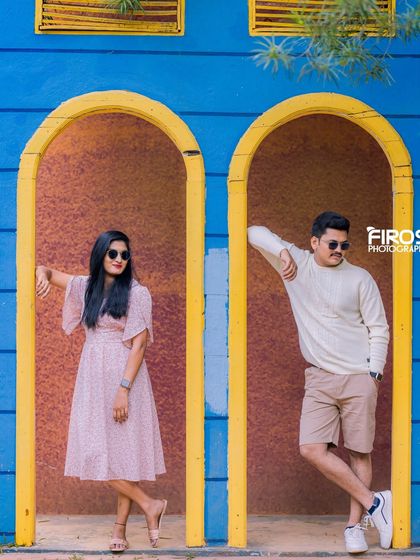 A cool and modern pose in our vibrant blue and yellow arched doorways.