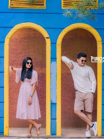 A cool and modern pose in our vibrant blue and yellow arched doorways.
