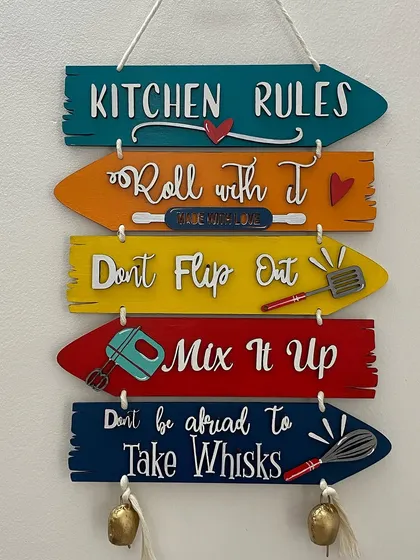 Add a splash of color and fun to your kitchen with my hand-painted "Kitchen Rules" wall decor. Each sign is crafted on wooden planks with quirky quotes and 3D elements, guaranteed to make everyone smile.