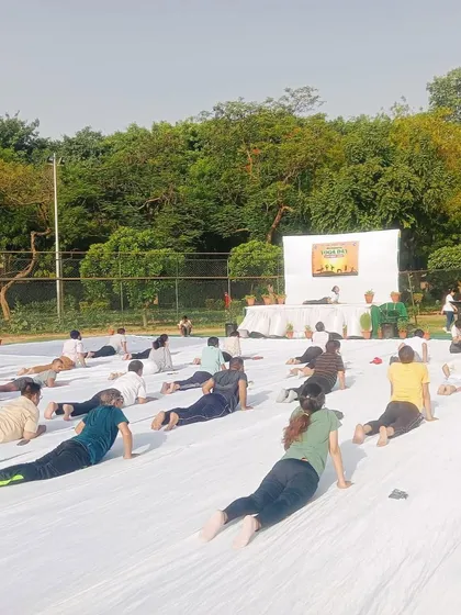 Guiding a group through Bhujangasana (Cobra Pose) at the Siri Fort event. This pose is fantastic for strengthening the spine and opening the chest, especially for those who sit a lot.