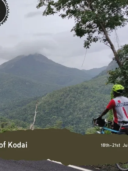 A rider pauses during the 'Tour of Kodai' to take in the view of a majestic mountain peak. Our tours are as much about the journey and the scenery as they are about the cycling itself.