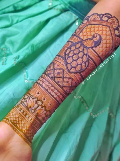A close-up of the peacock motif on the arm.